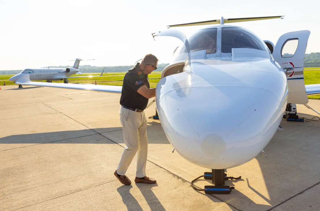 Men Inspecting Plane